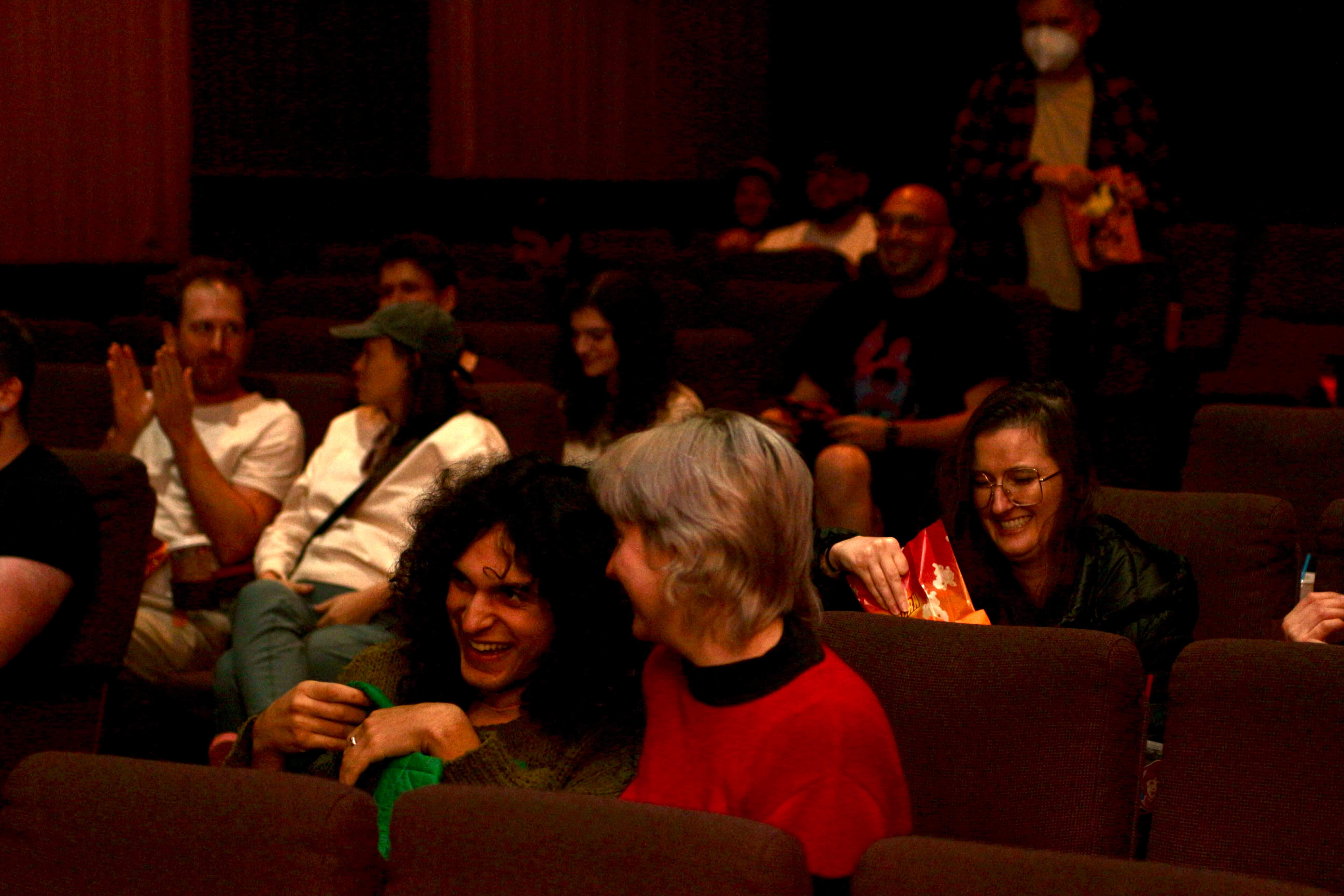 Audience laughter between reels.
